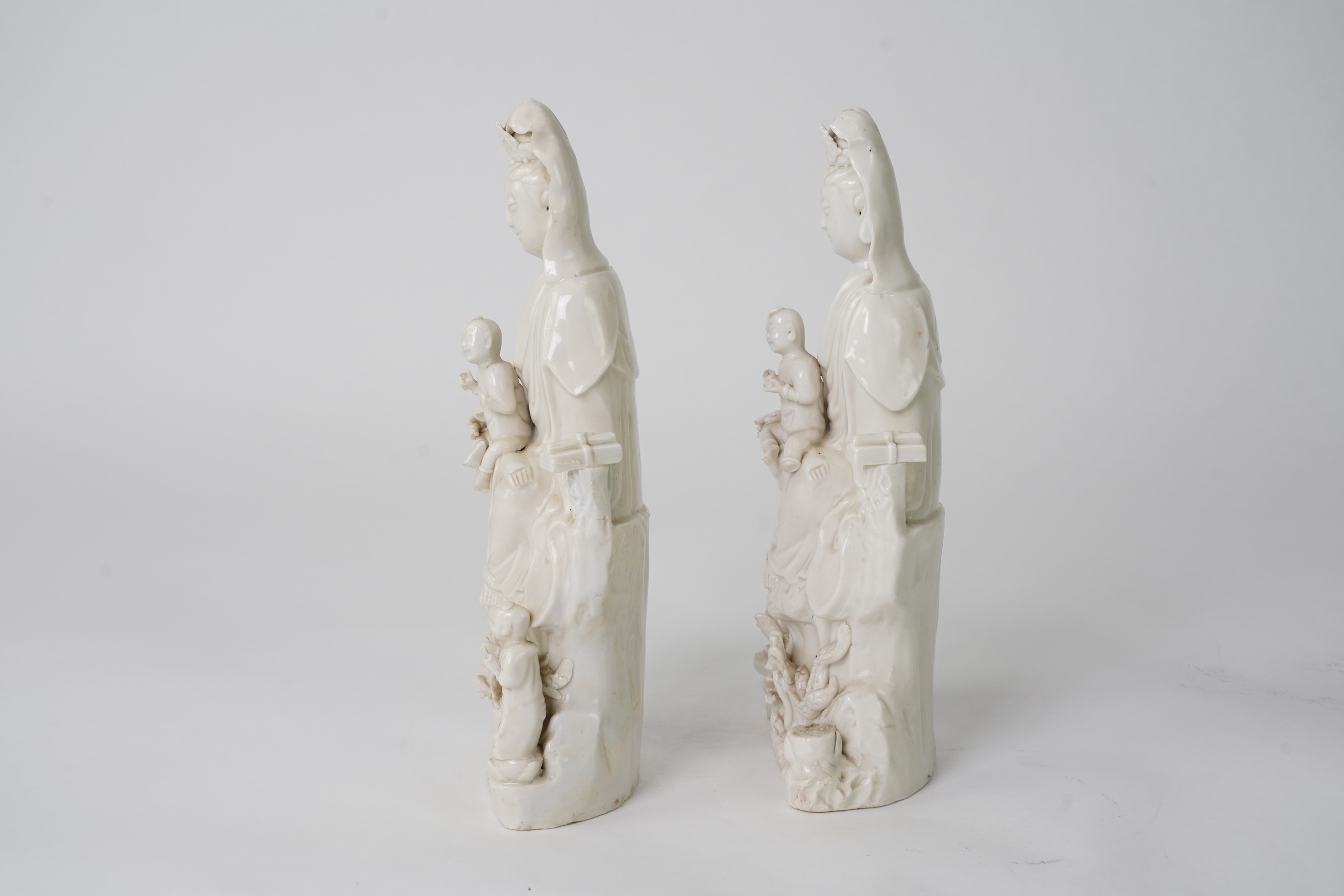 A pair of Chinese blanc de chine groups of Guanyin and children, 18th century
